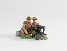 BRIT7 British 1939-45: Three Vickers guns on tripods with three seated gunners, three loaders