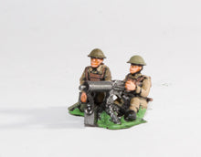 BRIT7 British 1939-45: Three Vickers guns on tripods with three seated gunners, three loaders