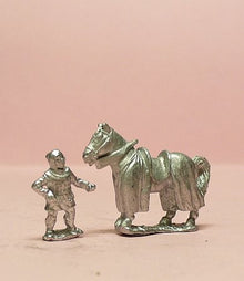 MID24 Two horseholders with four barded horses